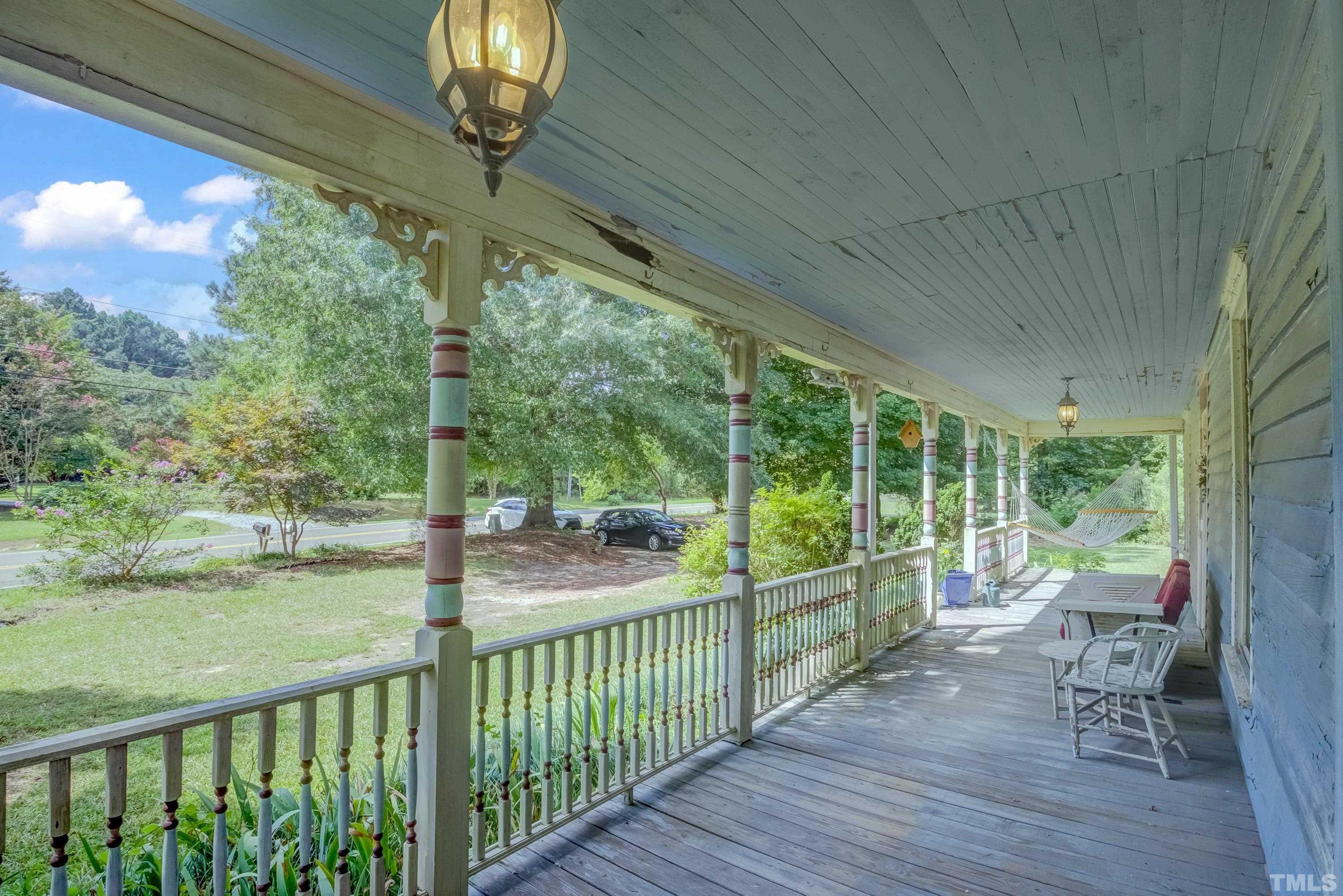 3614 Carpenter Pond Road Durham, NC 27703 - Photo 8 of 57 a view of a porch with furniture and wooden floor