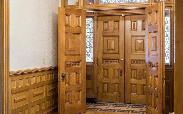 a bathroom with a glass door shower and vanity