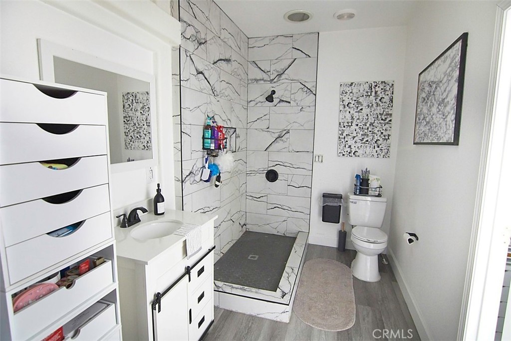51490 Forest Boundary Road Anza, CA 92539 - Photo 20 of 32 a bathroom with a sink toilet and shower
