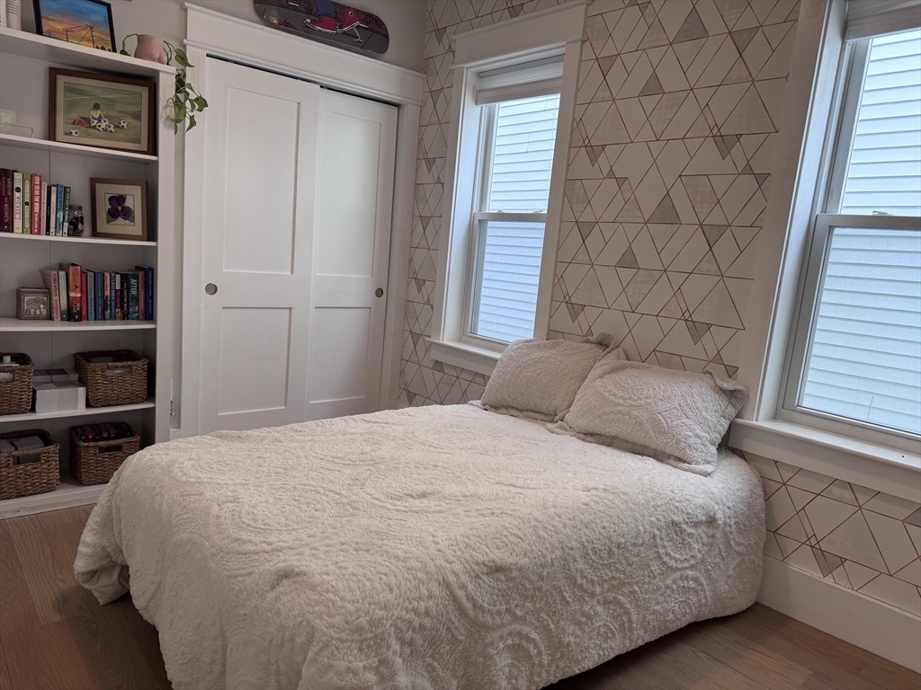 215 Maverick Street, Unit 2 Boston, MA 02128 - Photo 11 of 22 a bedroom with a bed and a window