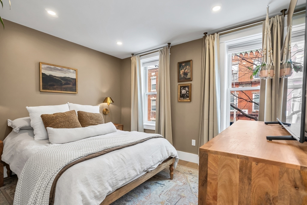 215 Maverick Street, Unit 2 Boston, MA 02128 - Photo 14 of 22 a bedroom with bed and a window