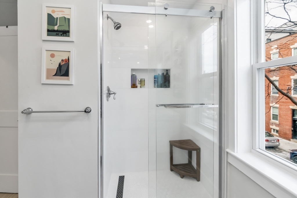 215 Maverick Street, Unit 2 Boston, MA 02128 - Photo 18 of 22 a bathroom with a shower and a sink