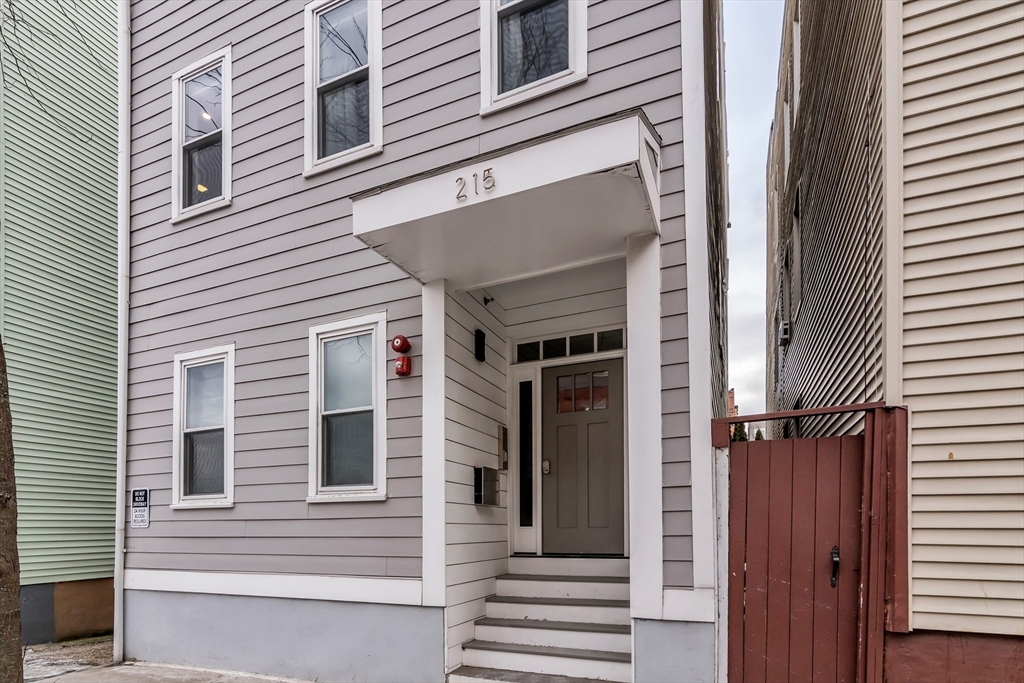 215 Maverick Street, Unit 2 Boston, MA 02128 - Photo 2 of 22 a view of a house with a door and a large window