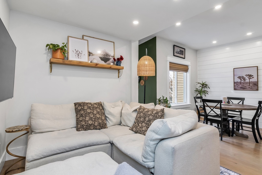215 Maverick Street, Unit 2 Boston, MA 02128 - Photo 7 of 22 a living room with furniture and kitchen view