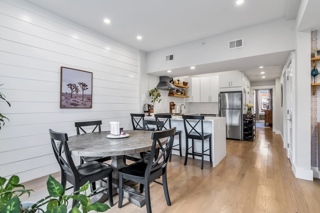 215 Maverick Street, Unit 2 Boston, MA 02128 - Photo 9 of 22 a view of a dining room with furniture