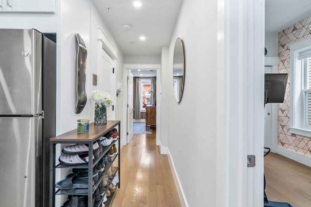 215 Maverick Street, Unit 2 Boston, MA 02128 - Photo 10 of 22 a view of a hallway with seating area