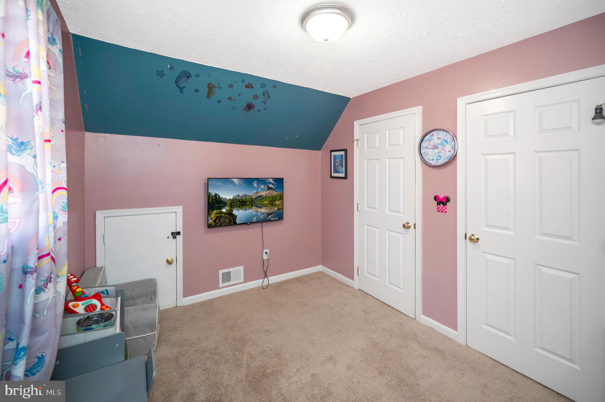 9577 Roys Lane Culpeper, VA 22701 - Photo 21 of 41 a bedroom with a bed and a flat tv screen on dresser