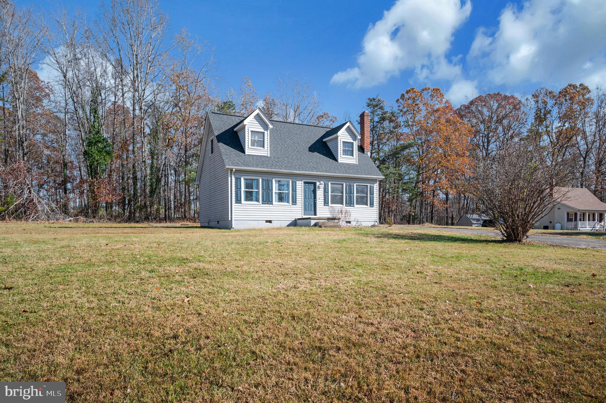 9577 Roys Lane Culpeper, VA 22701 - Photo 33 of 42 a front view of a house with a yard