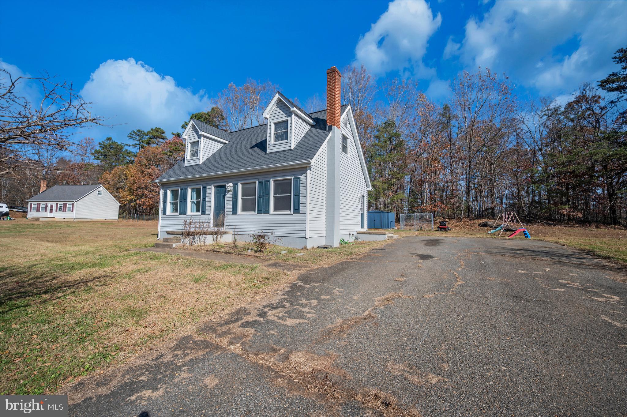 9577 Roys Lane Culpeper, VA 22701 - Photo 36 of 41 a front view of a house with a garden