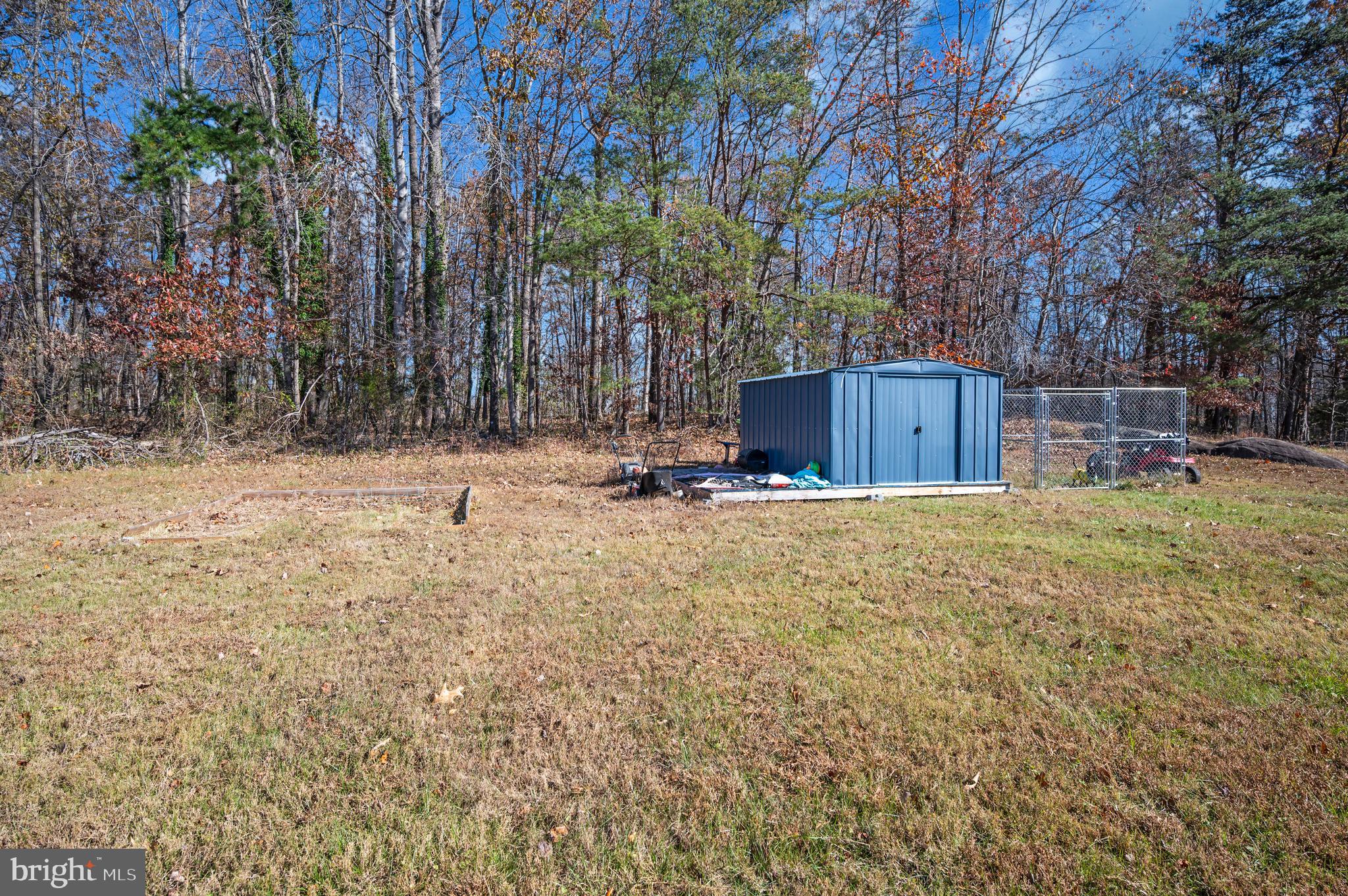 9577 Roys Lane Culpeper, VA 22701 - Photo 40 of 42 a view of swimming pool with a yard and trees