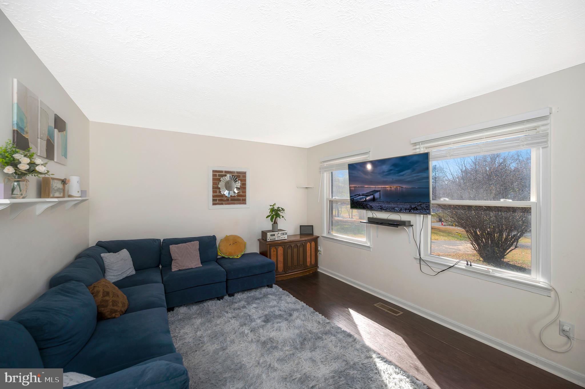 9577 Roys Lane Culpeper, VA 22701 - Photo 4 of 42 a living room with furniture and a flat screen tv