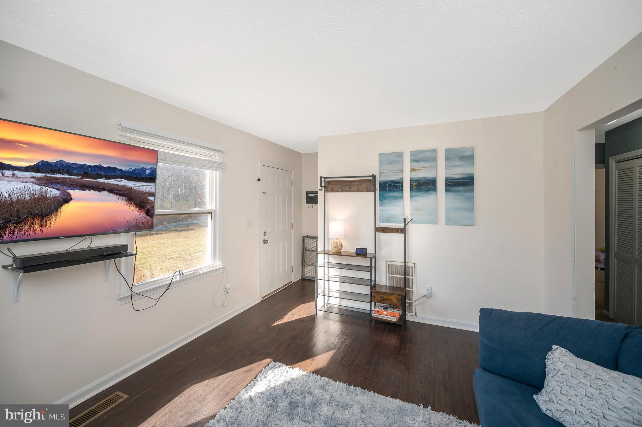 9577 Roys Lane Culpeper, VA 22701 - Photo 5 of 41 a living room with furniture and a wooden floor