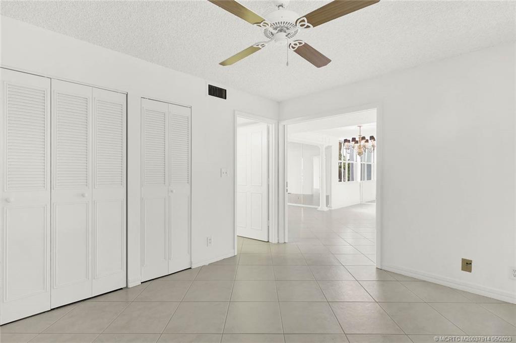 1950 Southwest Palm City Road, Unit 14207 Stuart, FL 34994 - Photo 26 of 50 Spacious second bedroom with private bath, double pocket doors, linen closet, and double closet.