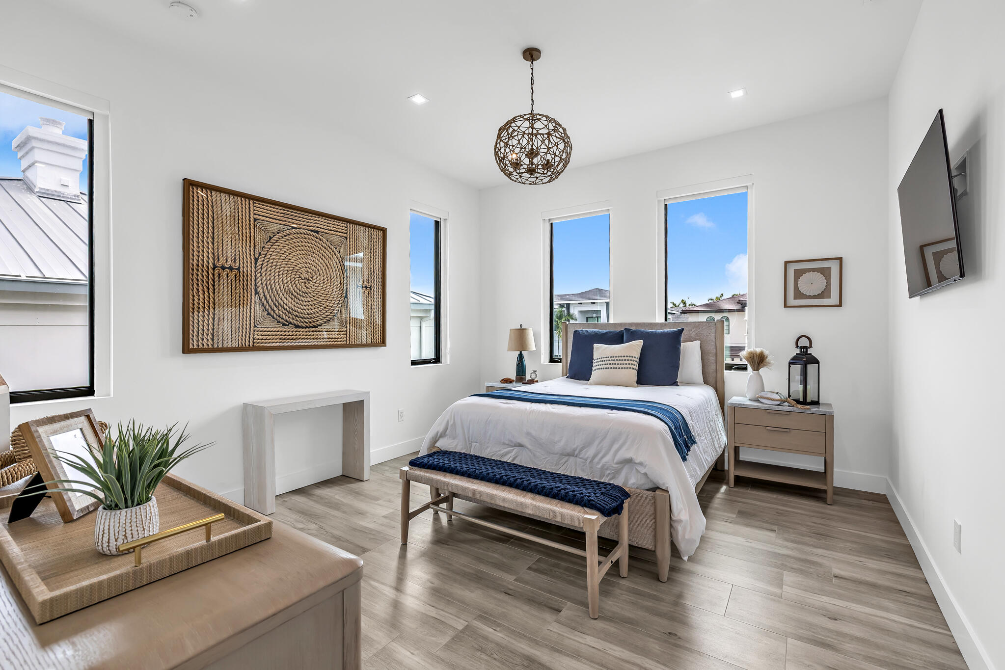 3711 Northeast 30th Avenue Lighthouse Point, FL 33064 - Photo 51 of 57 a bed room with a bed and a chandelier
