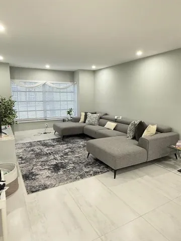 a living room with furniture and a couch