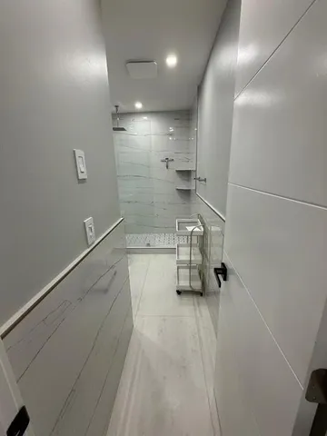 a view of an empty room with a window