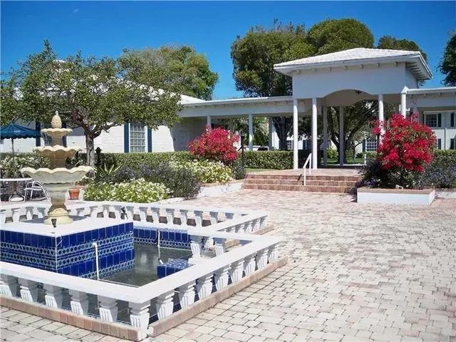 a view of a backyard with sitting area