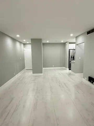 a view of a big room with a chandelier