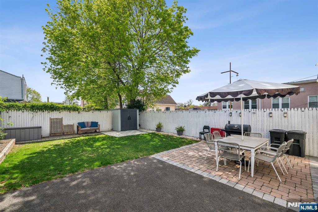 208 Jefferson Avenue Hasbrouck Heights, NJ 07604 - Photo 16 of 20 a roof deck view with a table and chairs