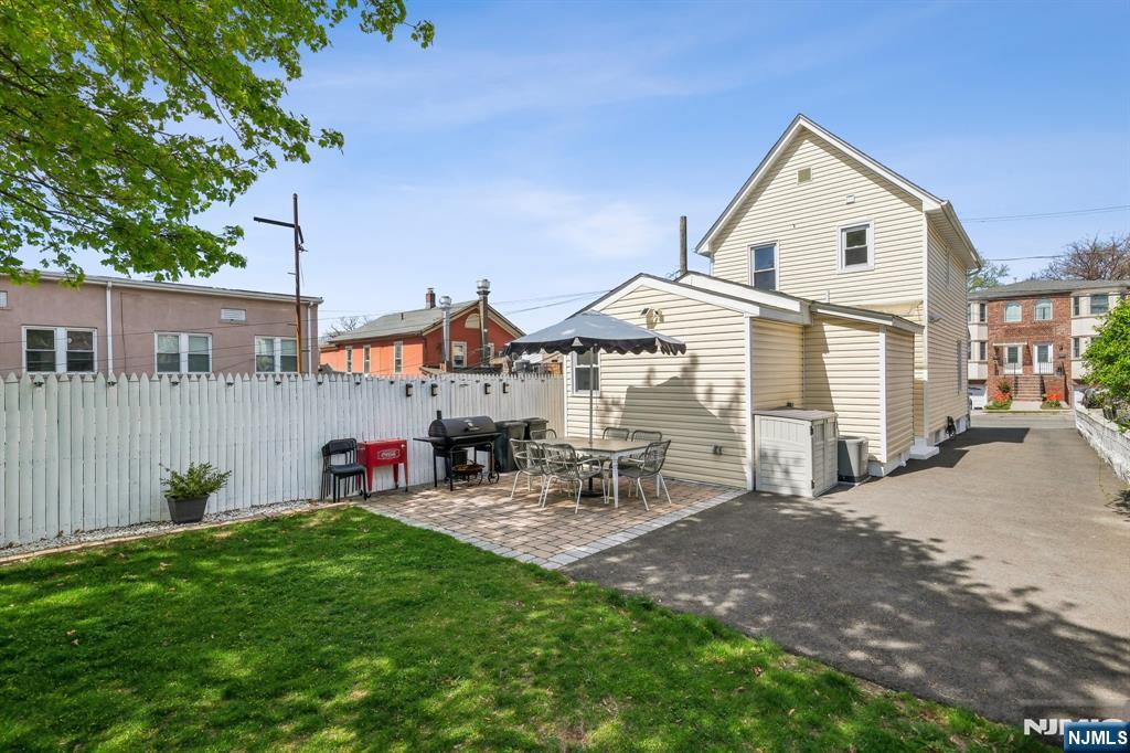 208 Jefferson Avenue Hasbrouck Heights, NJ 07604 - Photo 17 of 20 a front view of a house with patio
