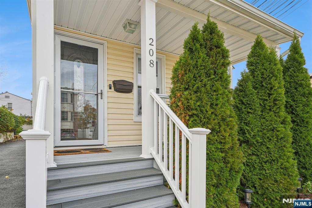 208 Jefferson Avenue Hasbrouck Heights, NJ 07604 - Photo 2 of 20 a view of a door of a house with a window