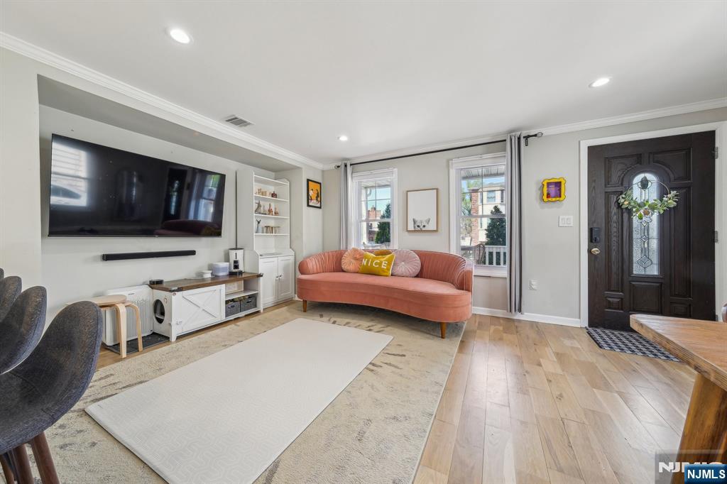 208 Jefferson Avenue Hasbrouck Heights, NJ 07604 - Photo 5 of 20 a bedroom with furniture and a flat screen tv