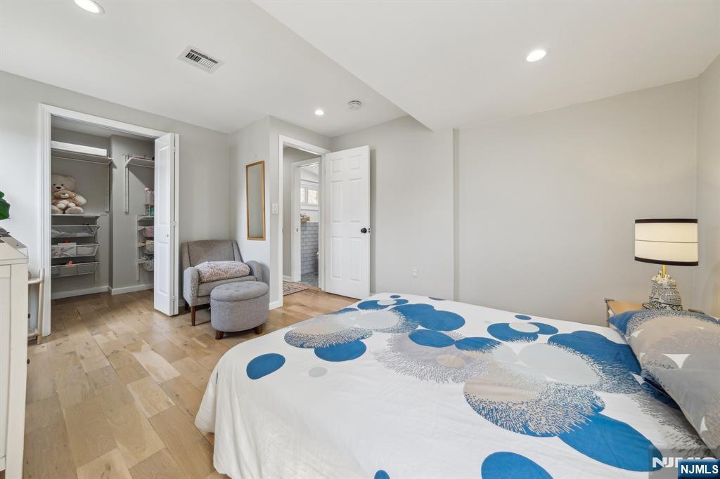 208 Jefferson Avenue Hasbrouck Heights, NJ 07604 - Photo 9 of 20 a bedroom with bed and a couch