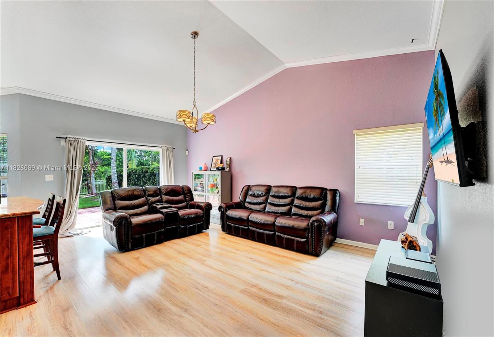 275 Southwest 198th Terrace Pembroke Pines, FL 33029 - Photo 12 of 35 a living room with furniture fireplace and flat screen tv