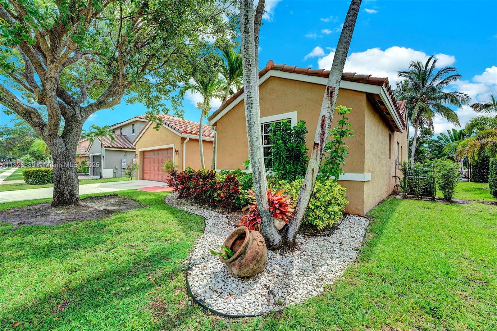 275 Southwest 198th Terrace Pembroke Pines, FL 33029 - Photo 2 of 35 a view of a house with backyard and sitting area