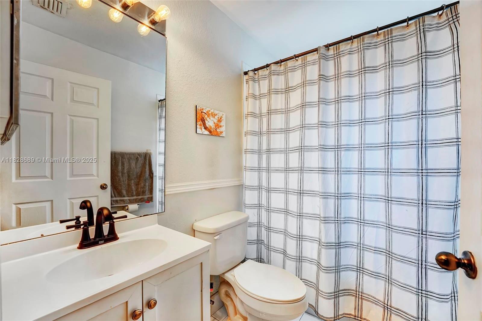 275 Southwest 198th Terrace Pembroke Pines, FL 33029 - Photo 21 of 35 a bathroom with a sink a toilet and shower