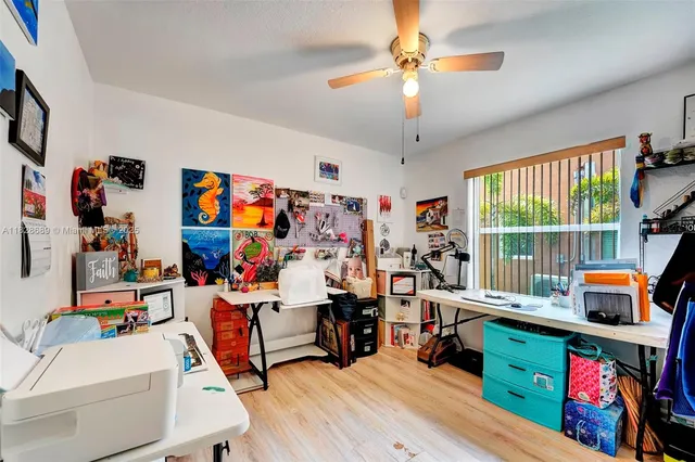 a utility room with dryer washer and a fridge