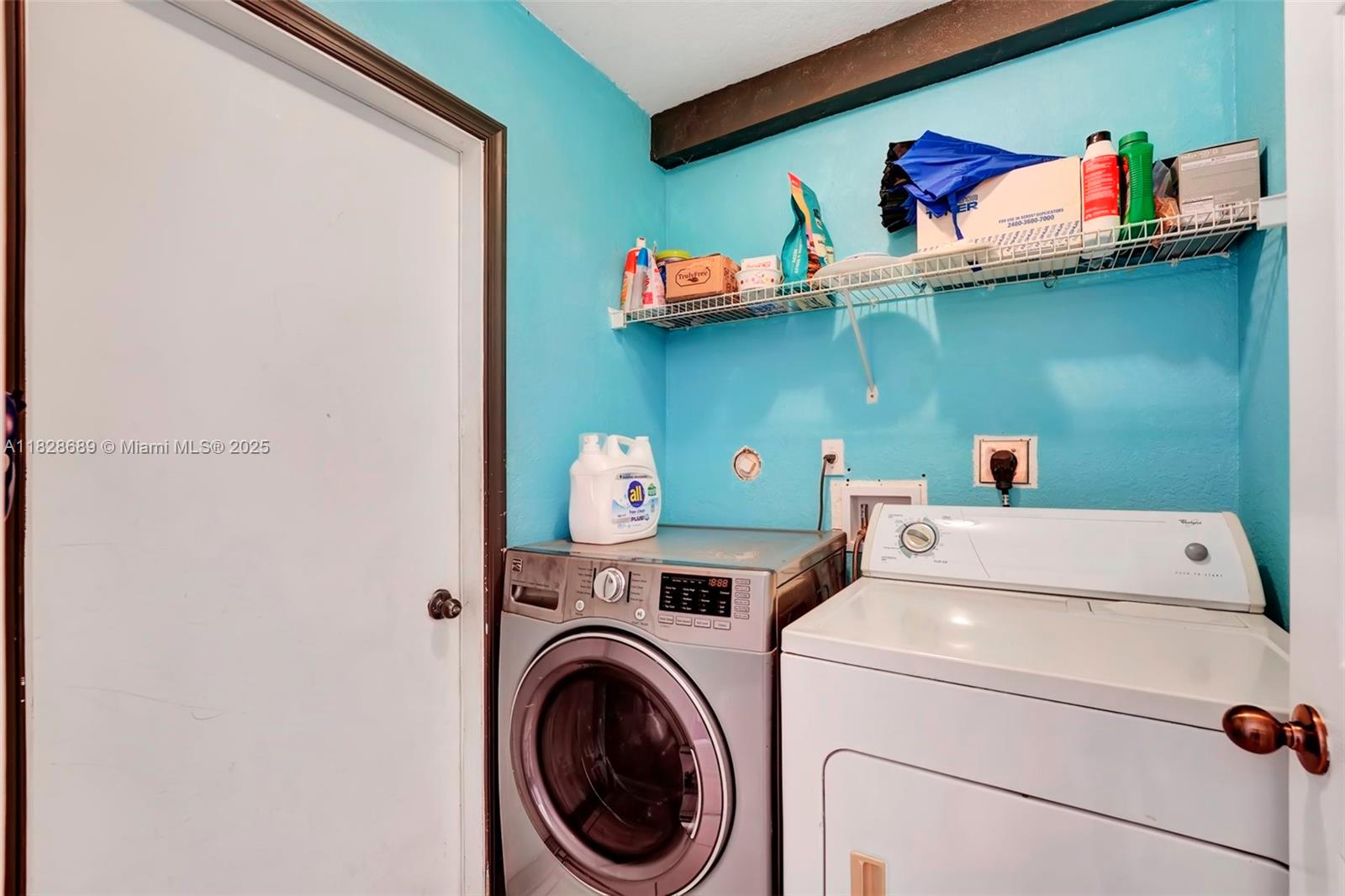 275 Southwest 198th Terrace Pembroke Pines, FL 33029 - Photo 24 of 35 a utility room with dryer washer and a fridge