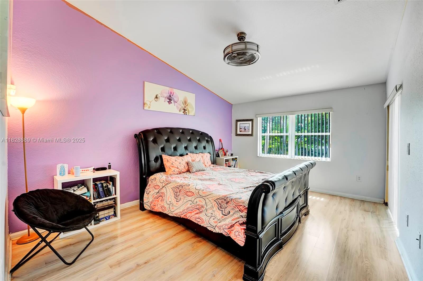 275 Southwest 198th Terrace Pembroke Pines, FL 33029 - Photo 25 of 35 a bedroom with a bed a dresser and chair