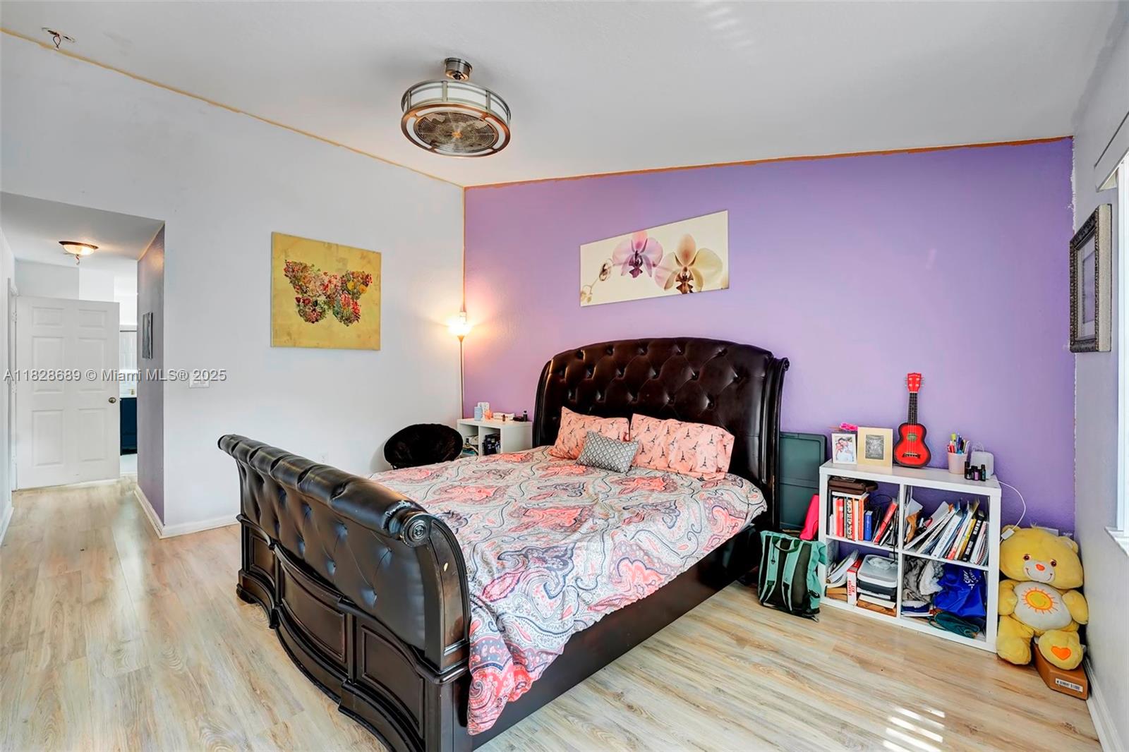 275 Southwest 198th Terrace Pembroke Pines, FL 33029 - Photo 26 of 35 a bedroom with a bed and a book shelf