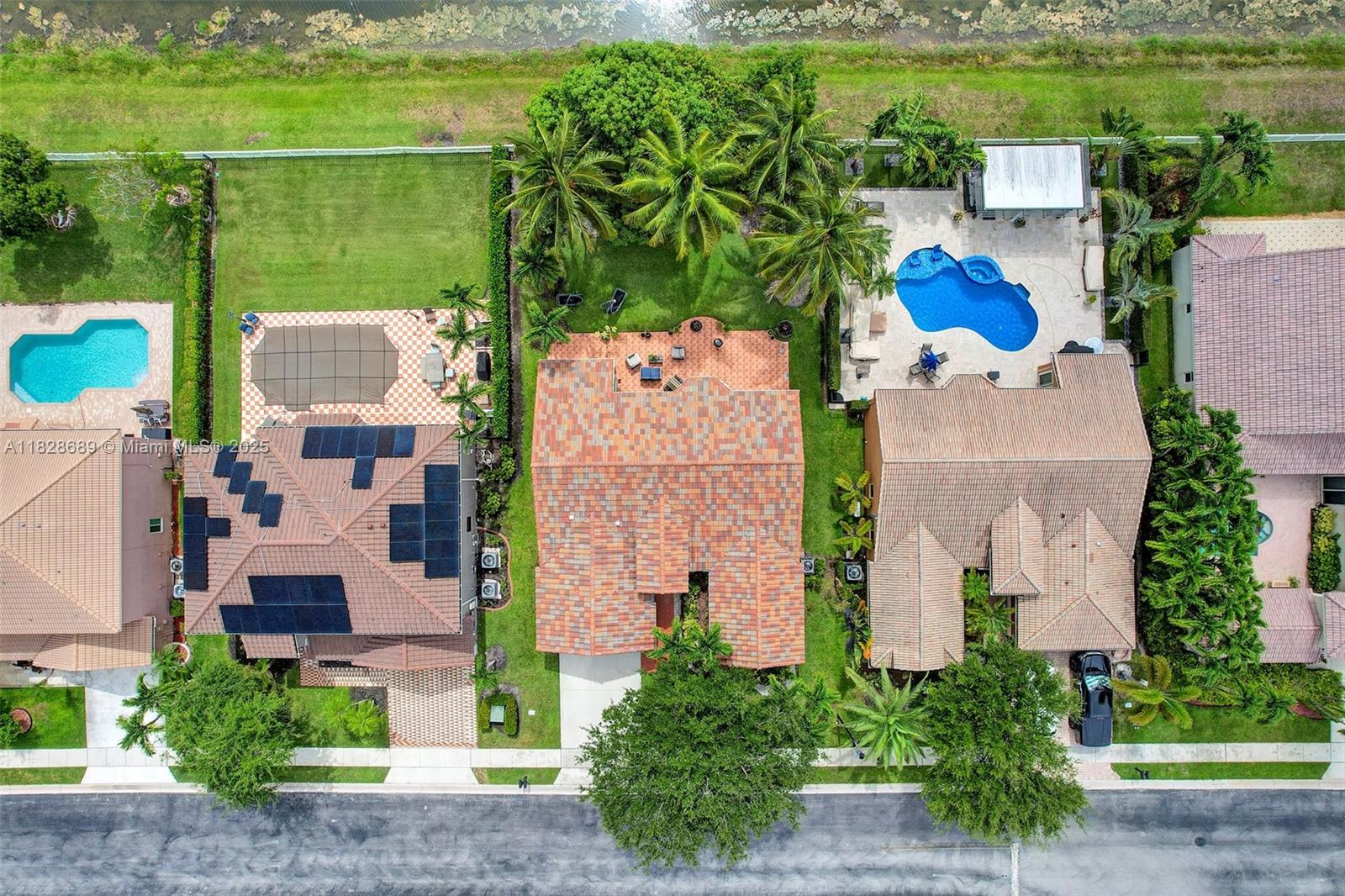 275 Southwest 198th Terrace Pembroke Pines, FL 33029 - Photo 35 of 35 an aerial view of a house with a garden and lake view
