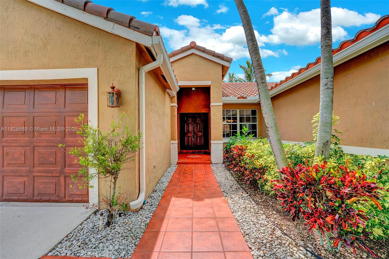275 Southwest 198th Terrace Pembroke Pines, FL 33029 - Photo 4 of 35 a view of a house with potted plants