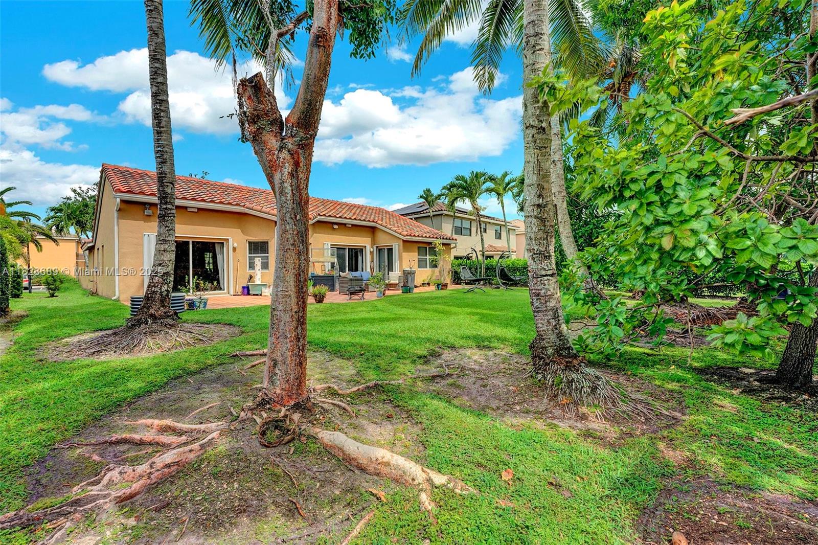 275 Southwest 198th Terrace Pembroke Pines, FL 33029 - Photo 6 of 35 a front view of a house with garden
