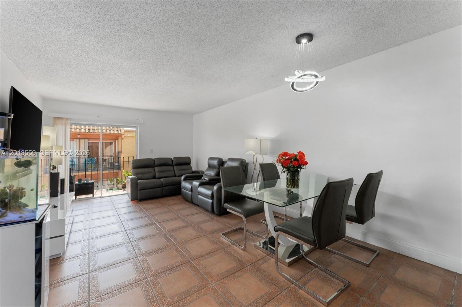 1950 West 54th Street, Unit 406 Hialeah, FL 33012 - Photo 5 of 15 Living/Dining room