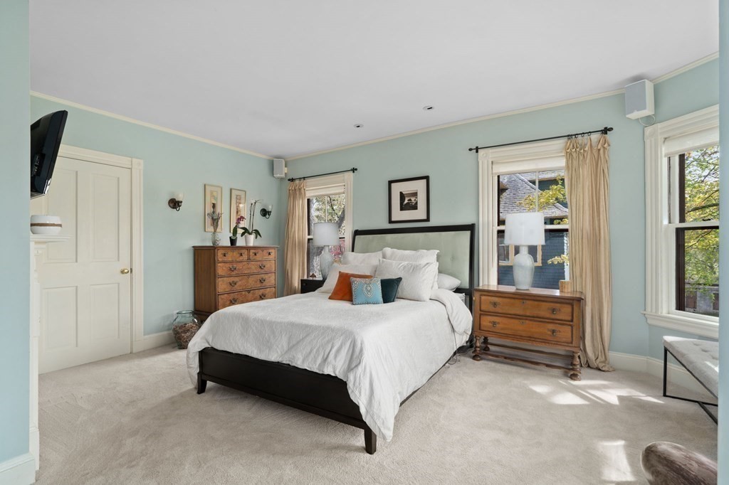 53 Oxford Road Newton, MA 02459 - Photo 15 of 32 a bedroom with a bed and a cabinets