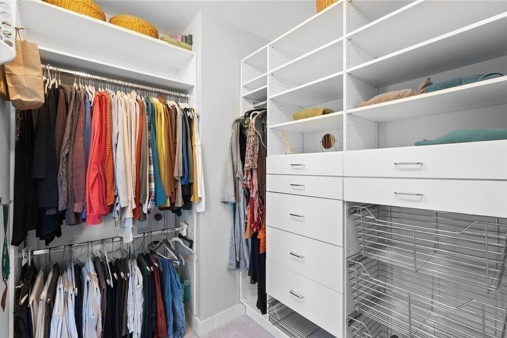 53 Oxford Road Newton, MA 02459 - Photo 18 of 32 a view of walk in closet with clothes