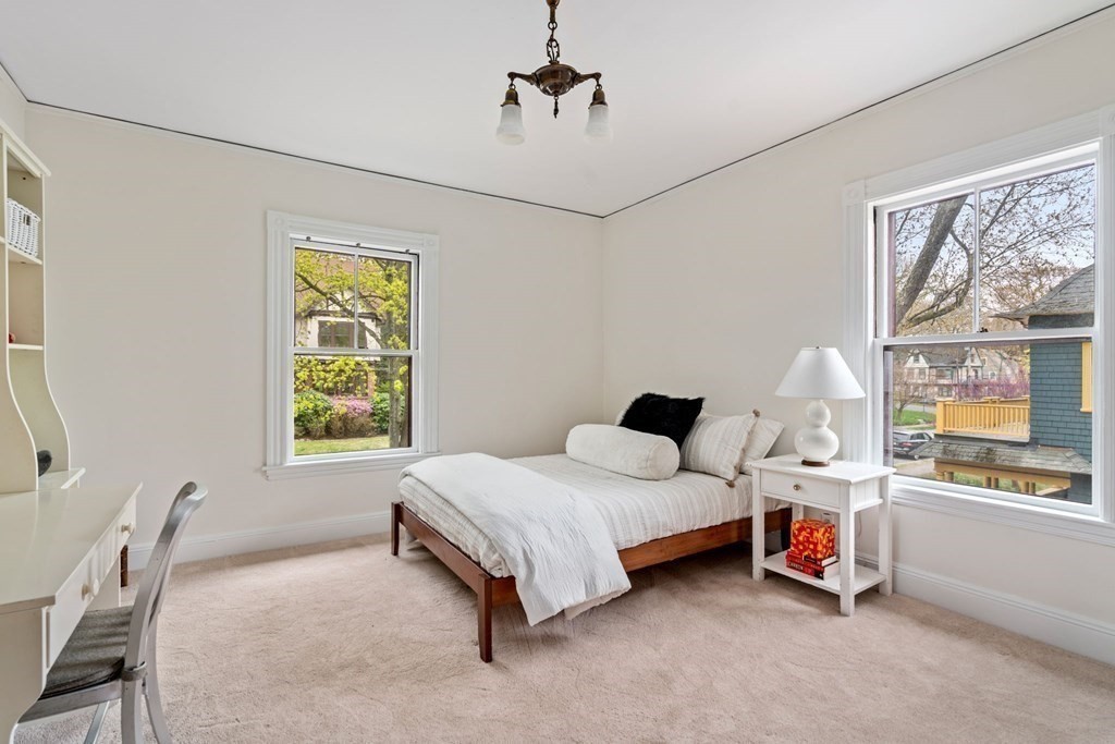 53 Oxford Road Newton, MA 02459 - Photo 24 of 32 a bedroom with a bed and a window