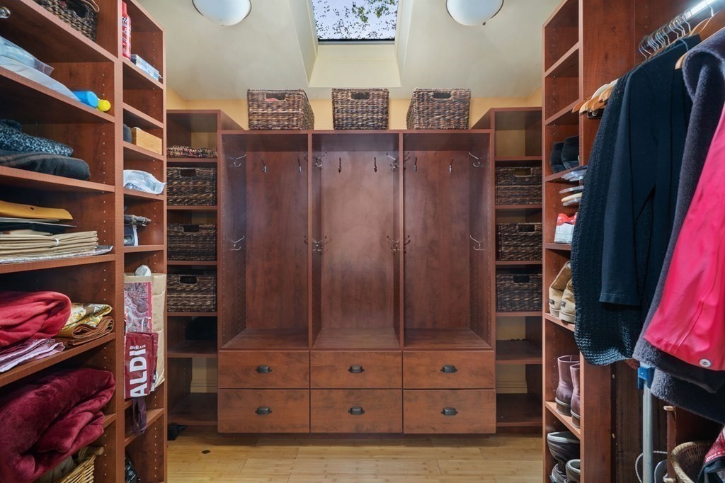 53 Oxford Road Newton, MA 02459 - Photo 6 of 32 a view of walk in closet with clothes and shoes