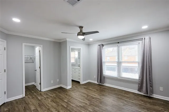a view of livingroom with hardwood floor and a ceiling fan