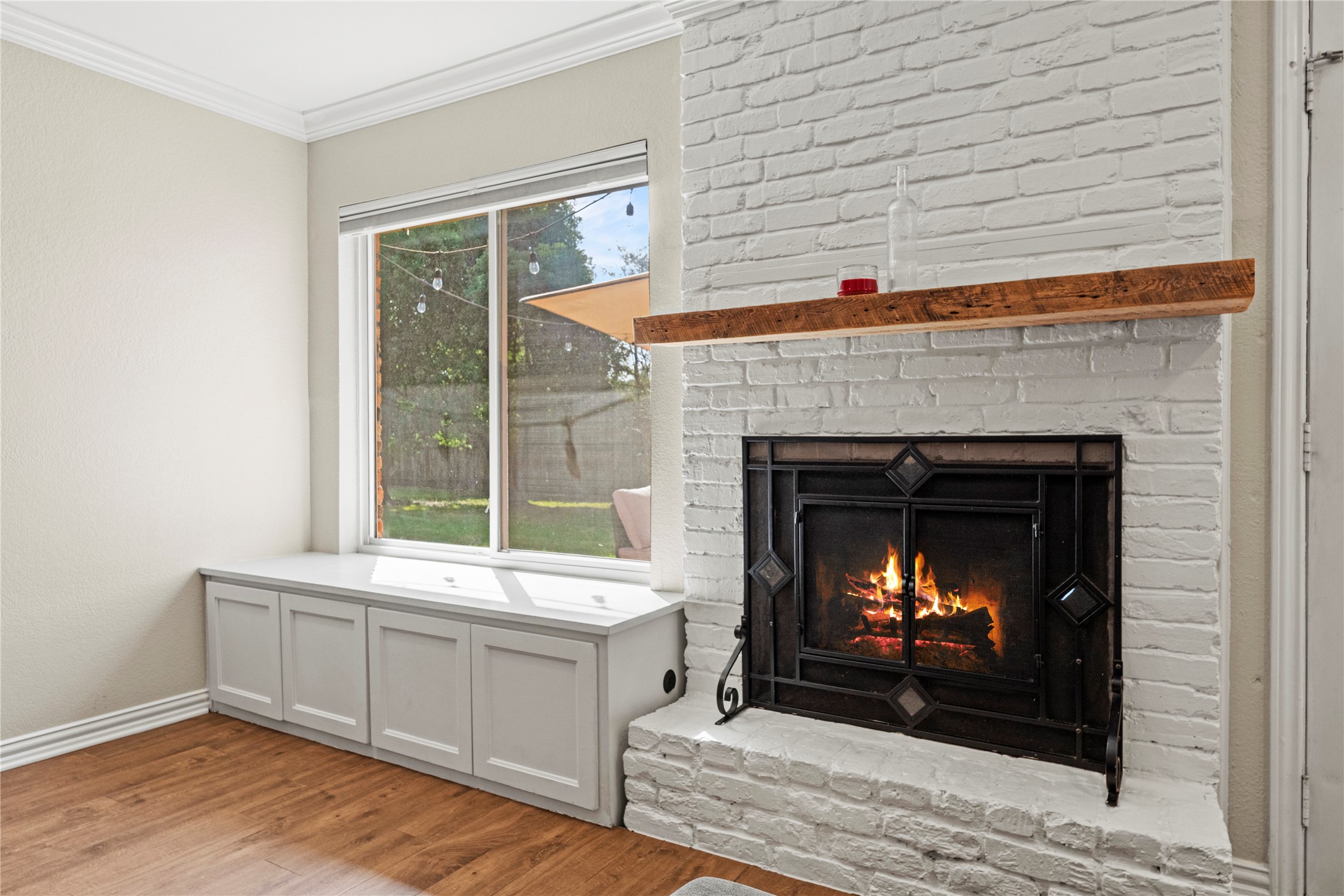 6031 McKnight Street Houston, TX 77035 - Photo 12 of 37 Enjoy a cozy fire in the family room.