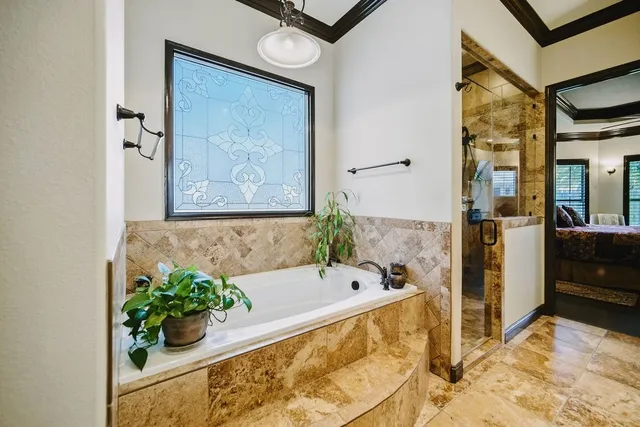 a bath room with a bathtub and a shower