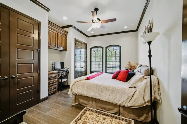 a bed room with a bed and a chandelier