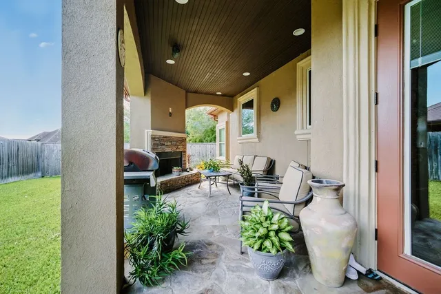 a lobby with furniture and a potted plant