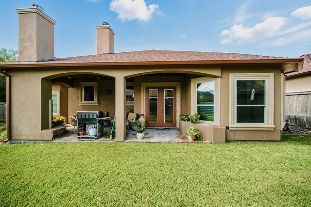 a view of a house with outdoor seating space
