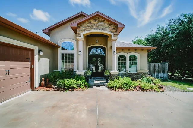a view of a house with large windows
