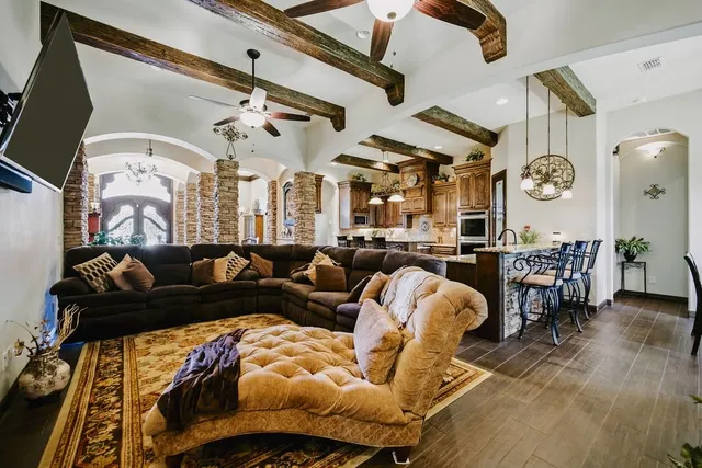 a living room with furniture and a clock